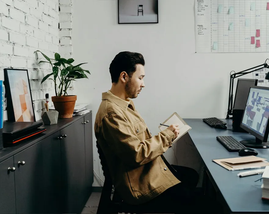 A product manager reviewing UX design work at a desk